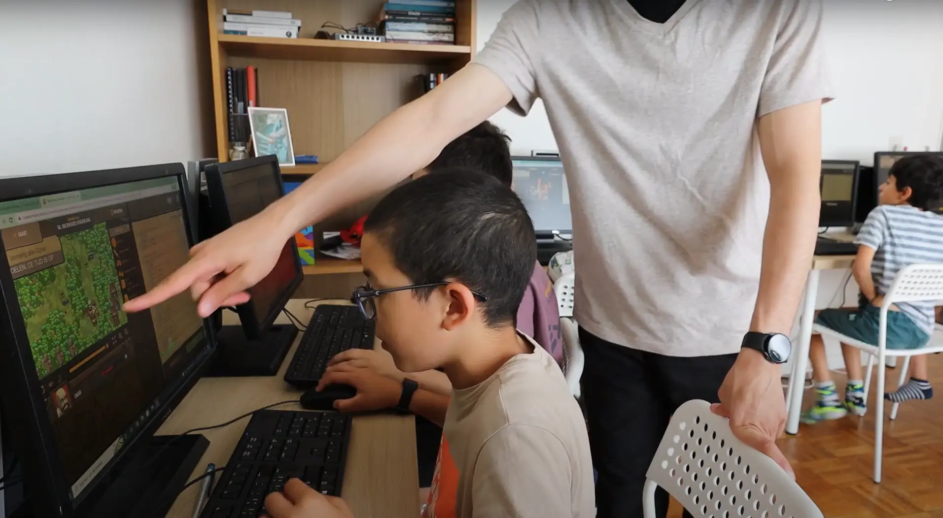 Adam teaching at Savoye school